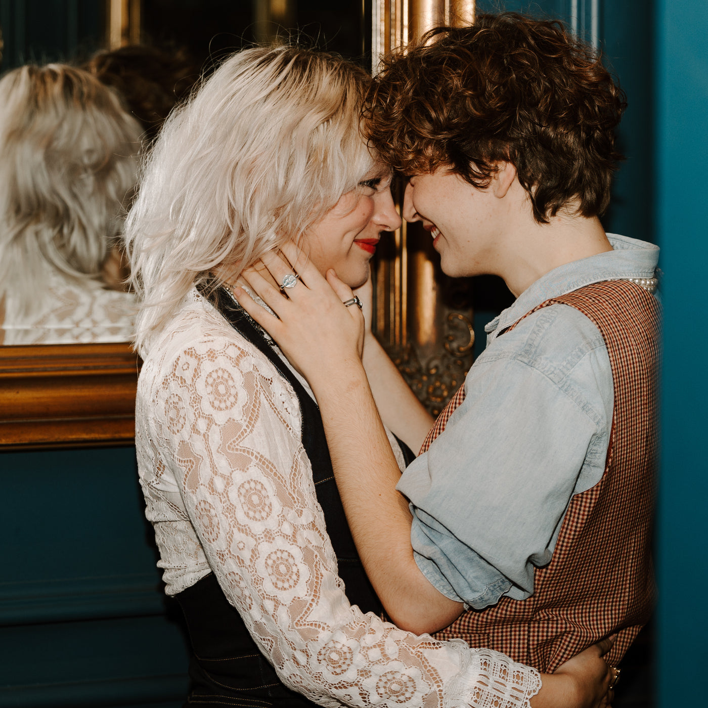 Two people embracing wearing fidget jewelry