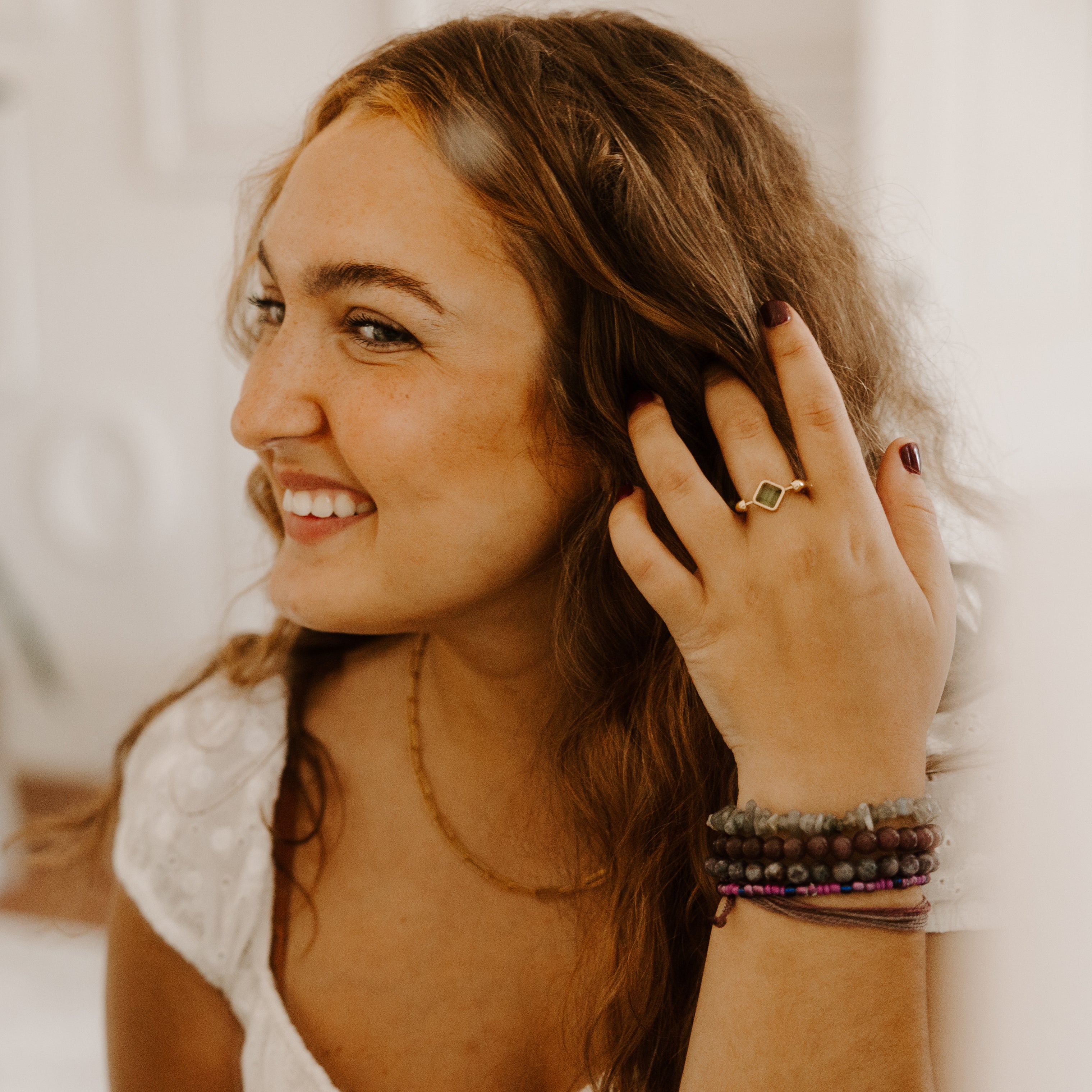 Person Wearing Birthstone Fidget Ring, Playing With Their Hair