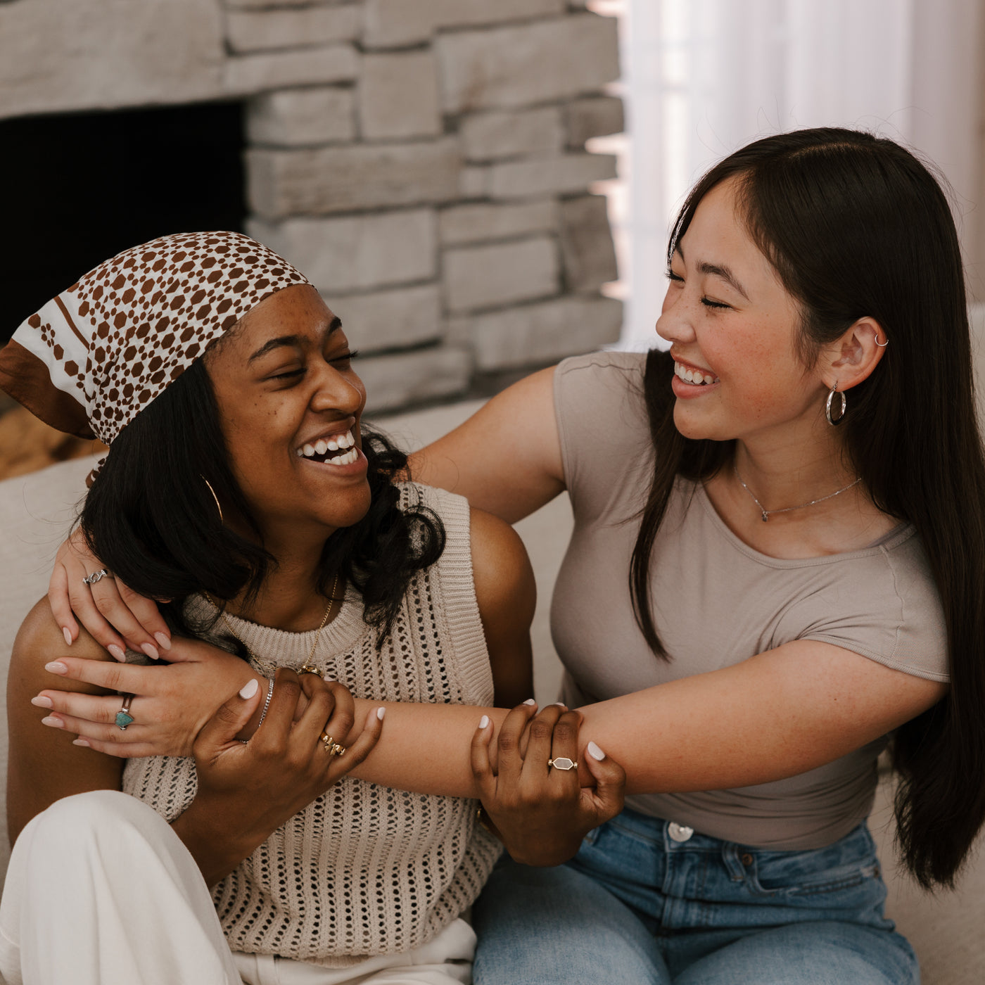 Two Friends Embracing in a hug, wearing Fidget Rings