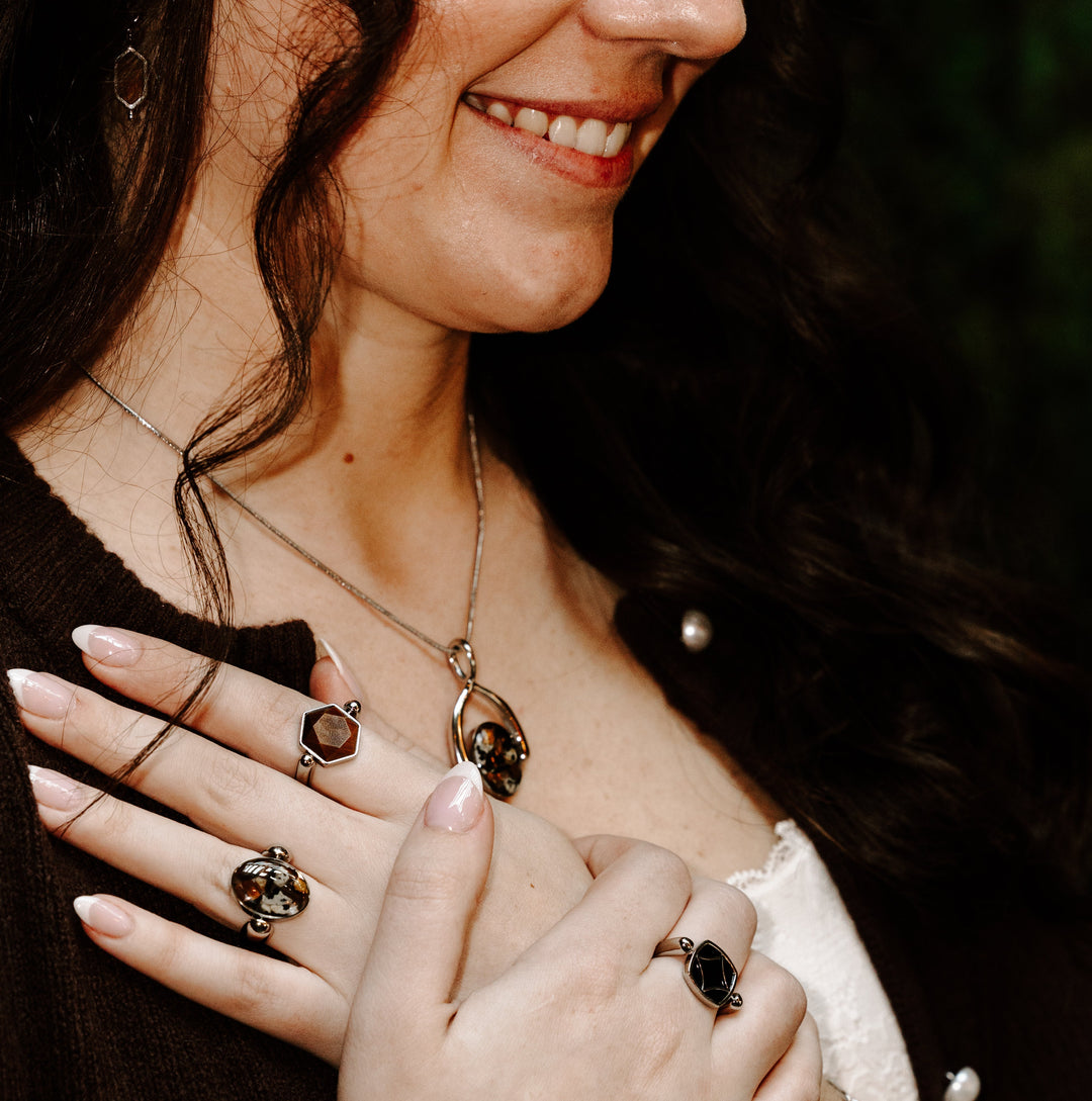 Photograph of person wearing crystal fidget jewelry