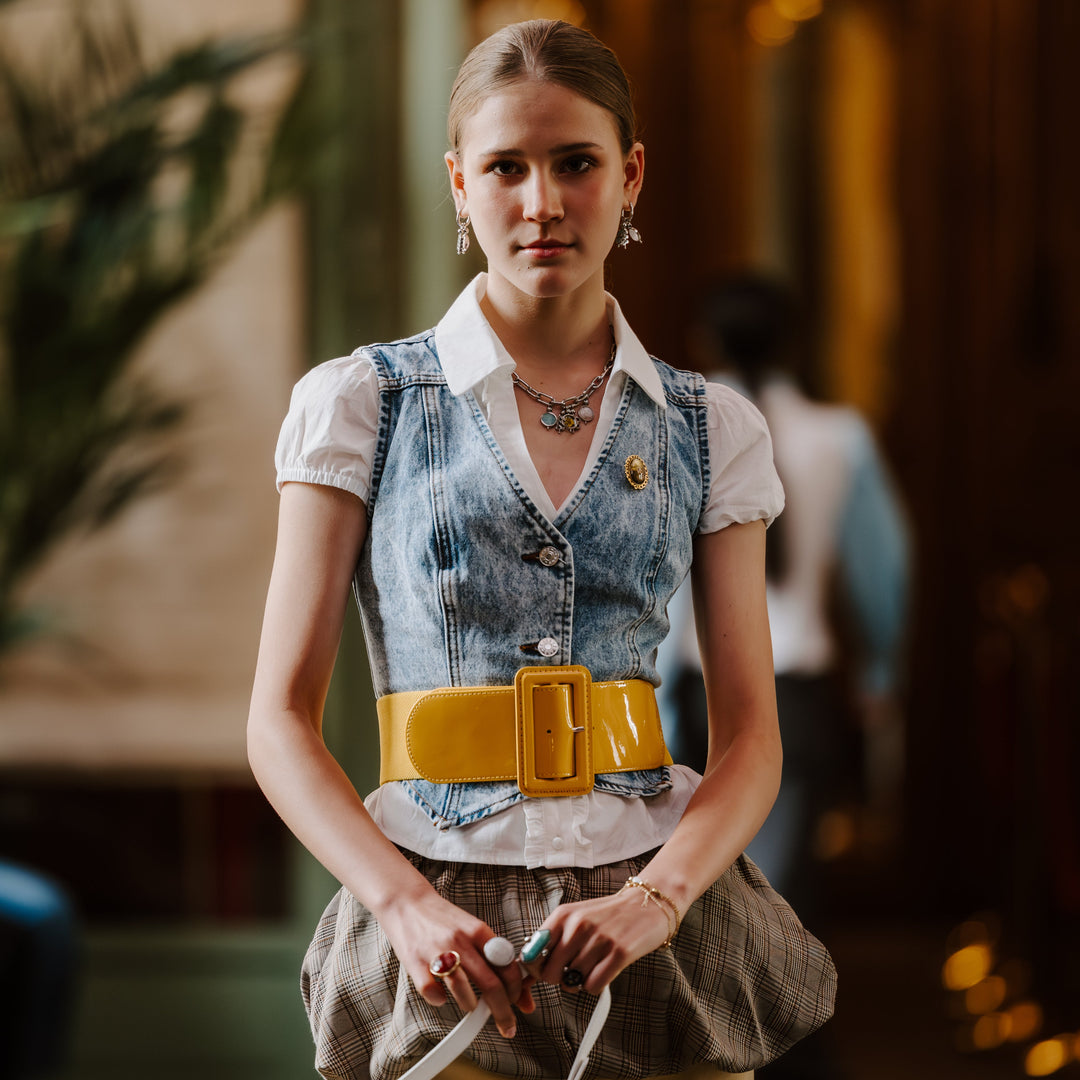 Person posing on a runway wearing trendy fidget jewelry