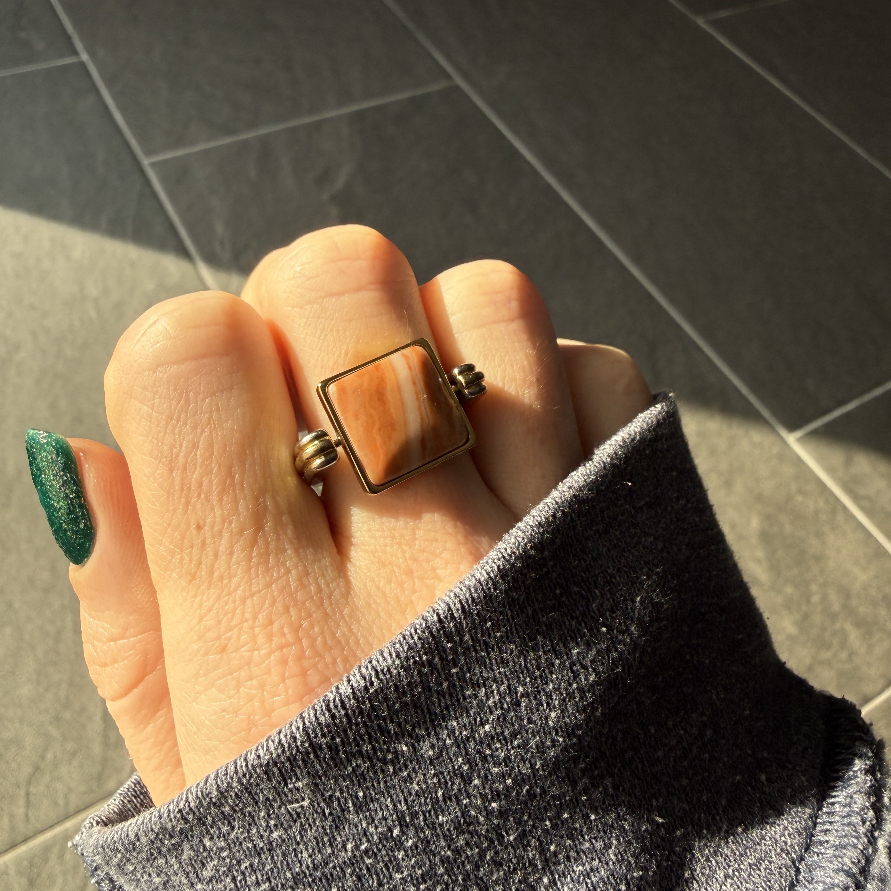 Photograph of cushion-shaped Aragonite crystal fidget ring