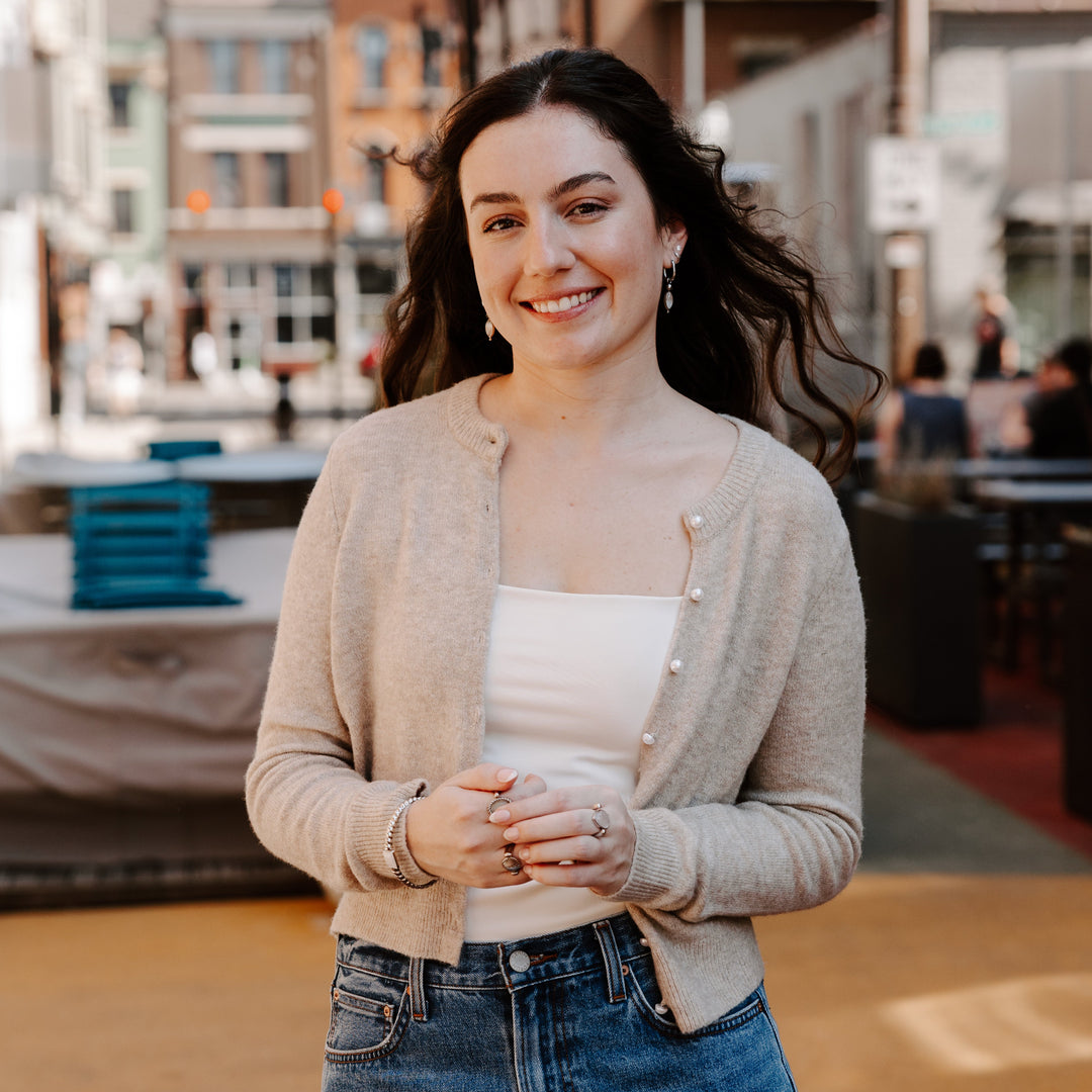 Photograph of person outside wearing anxiety jewelry