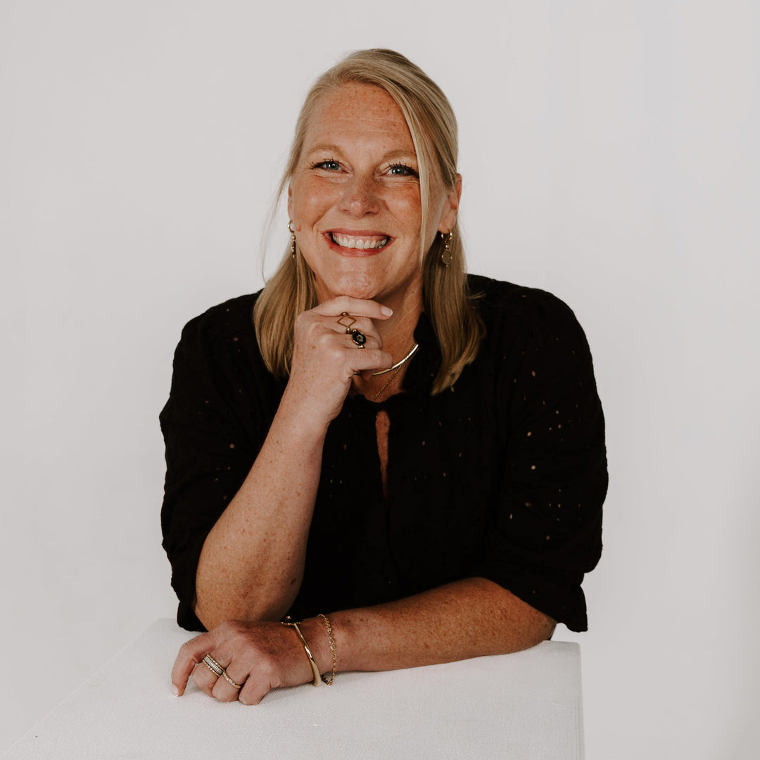CONQUERing Brand Marketer Posing for Headshot wearing fidget jewelry