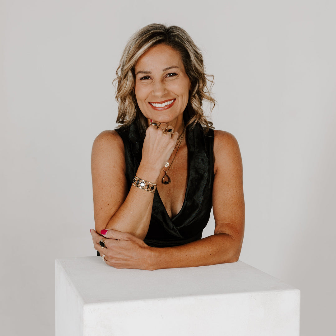Headshot of CONQUERing CEO who is wearing fidget jewelry