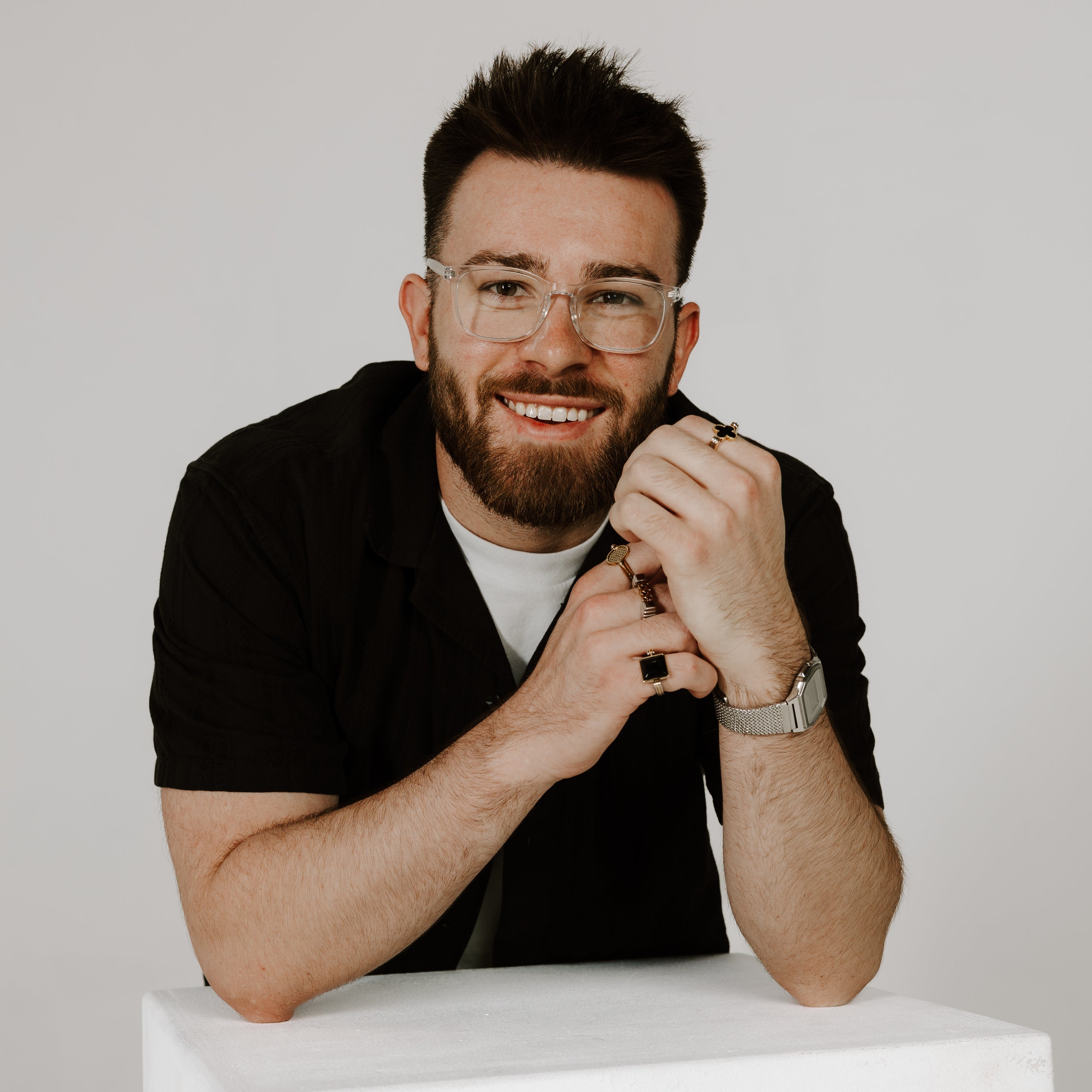 CONQUERing Co-Creator Posing for Headshot wearing fidget jewelry