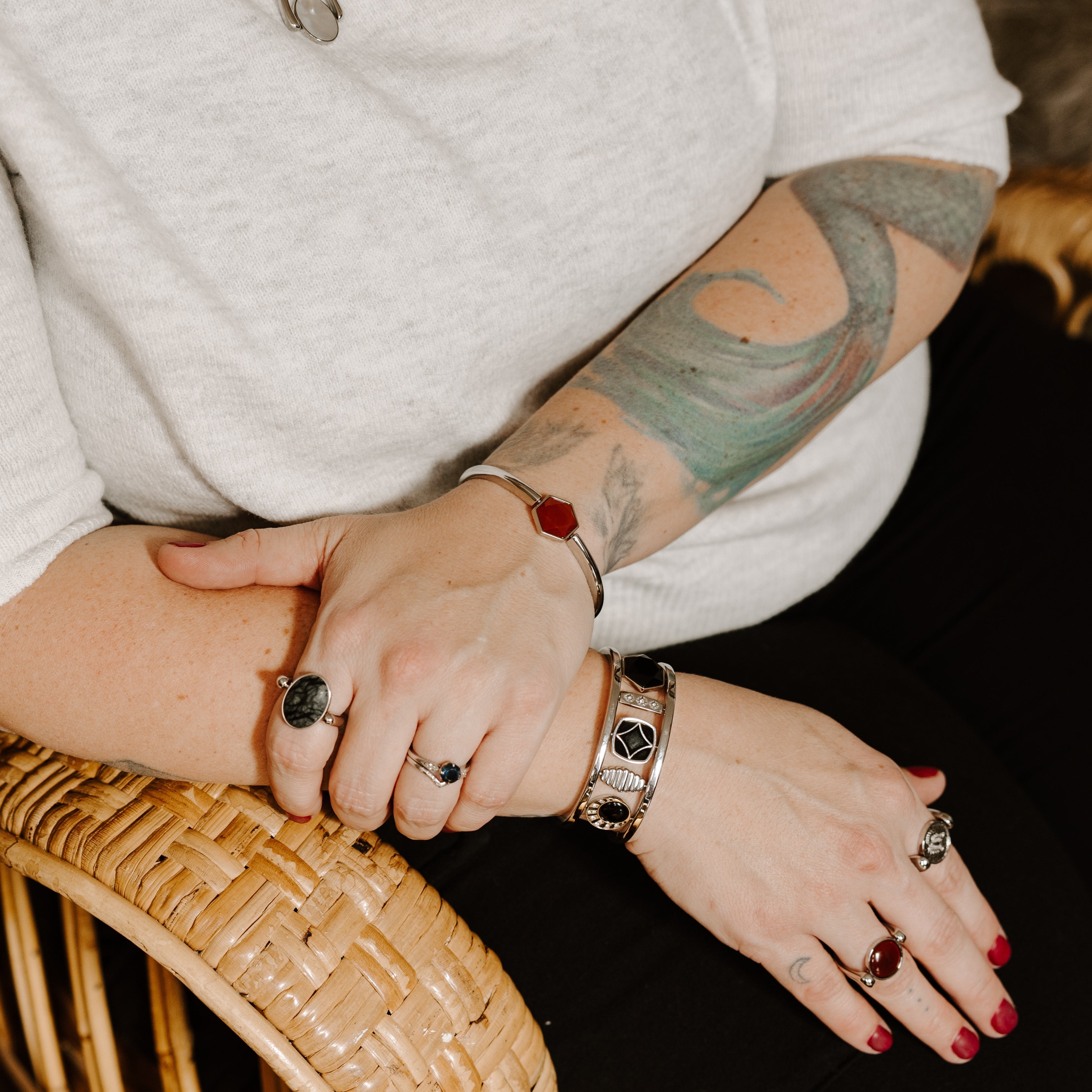 Lifestyle photo of person wearing fidget rings and bracelets