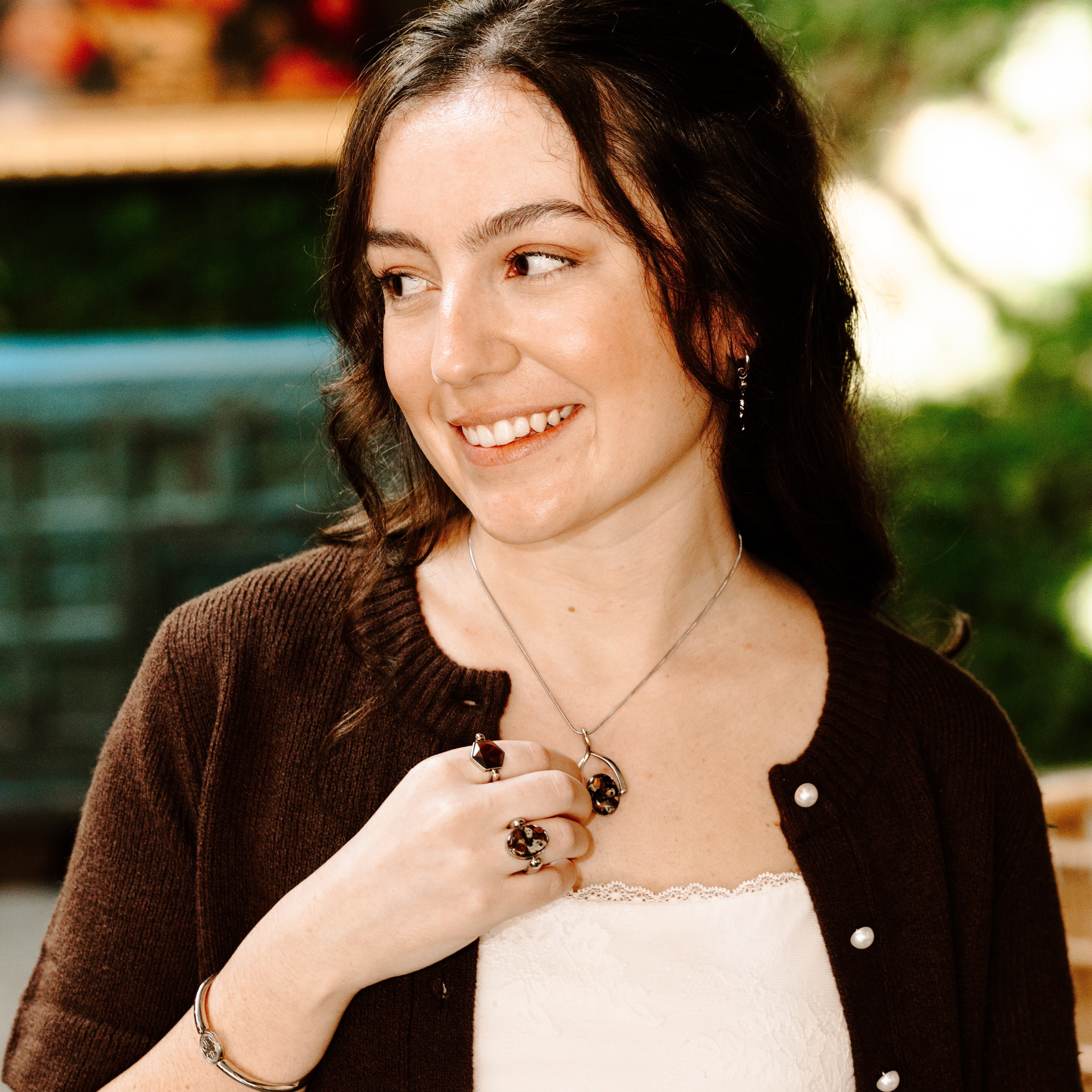 Person wearing crystal jewelry for manifestation