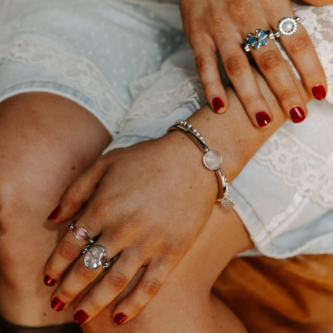 Person showing off personal style with fidget rings and bracelet