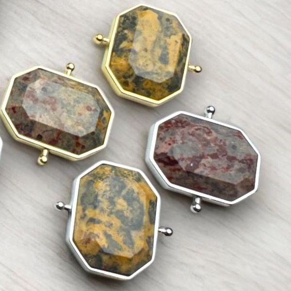 Four Leopard Skin Jasper Octangle Elements against a wood background