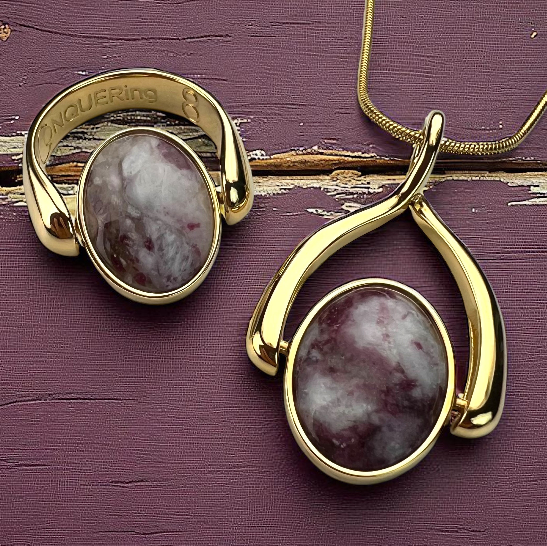 Lifestyle photograph of gold Pink Tourmaline crystal fidget ring and necklace
