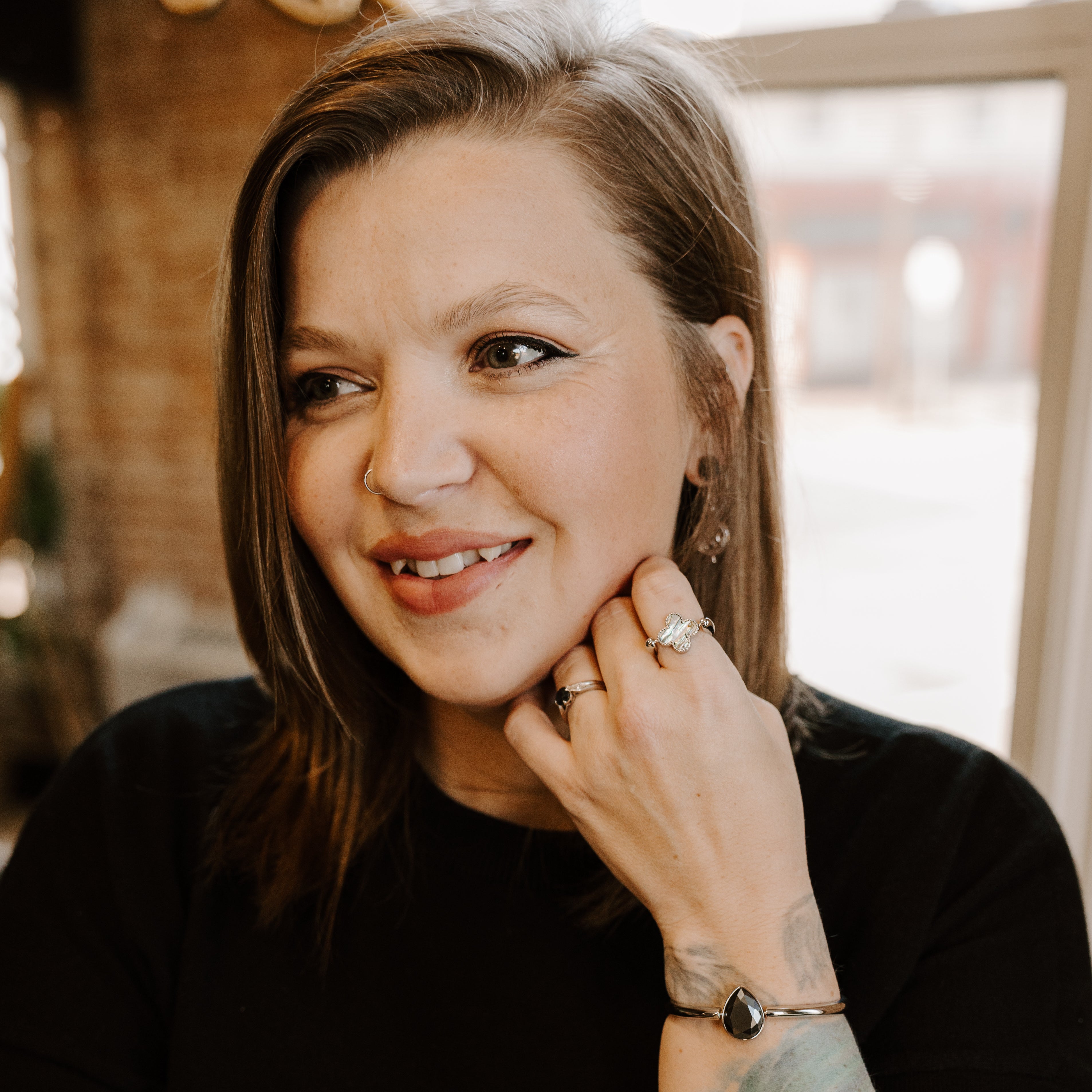 Person posing wearing crystal fidget jewelry