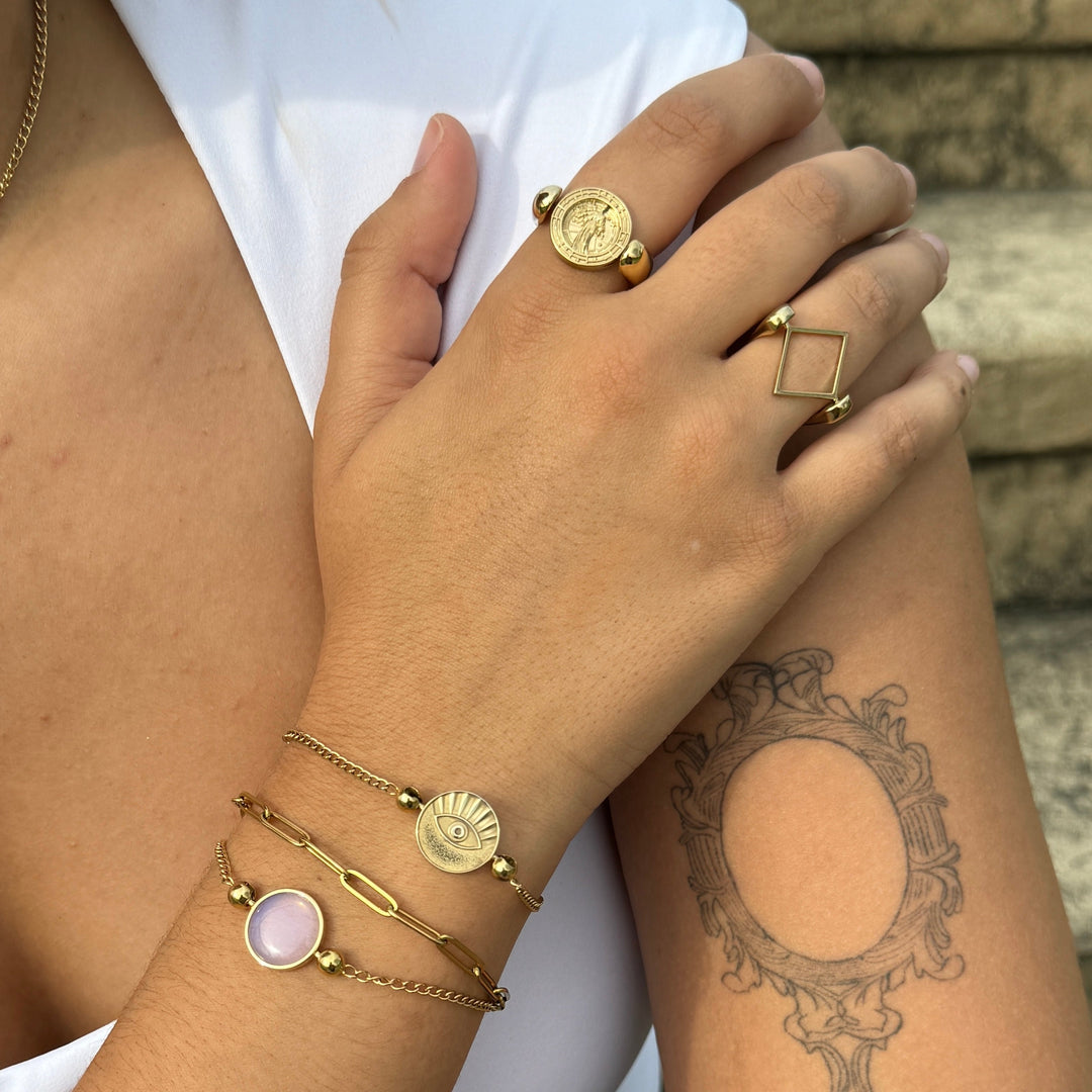 Photograph of gold fidget jewelry including 3D crafted zodiac sign