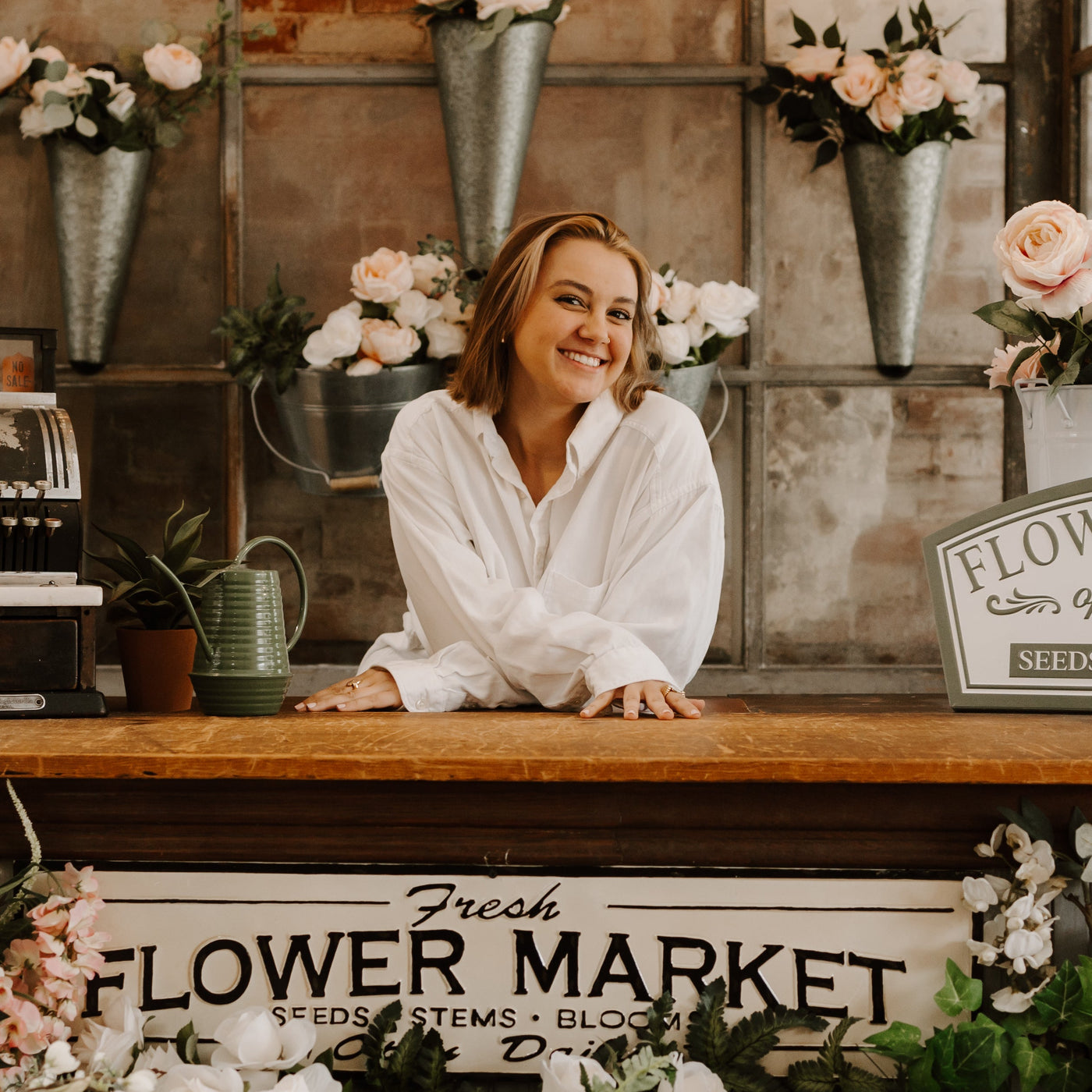 Person running a flower shop wearing fidget jewelry