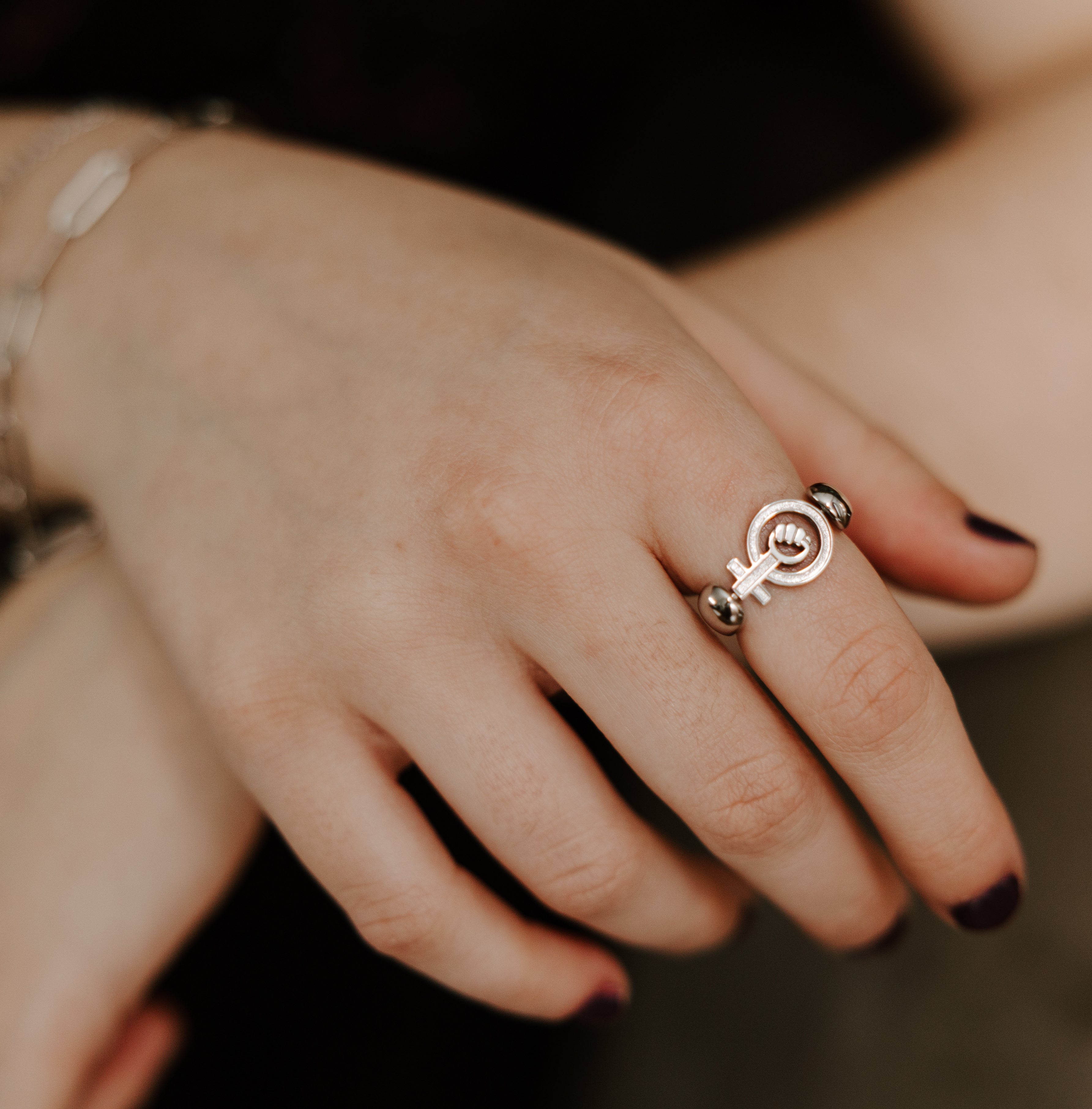 Lifestyle photo of EmpowHer™ silver fidget ring