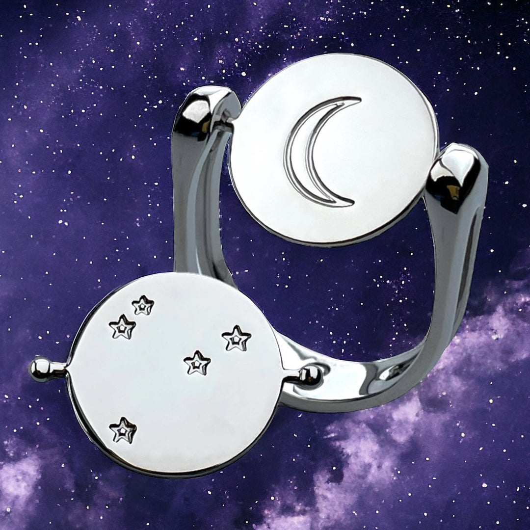 Lifestyle Photo ofMoon and Star Fidget Rings on Galaxy Background