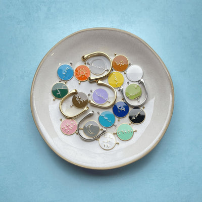 bright chroma spinners and ring bases in cream dish on blue background